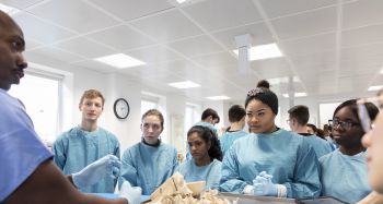 BSMS students being taught anatomy with a demonstrator in the Dissection Suite