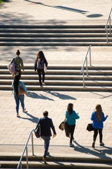 Students and staff walking through campus