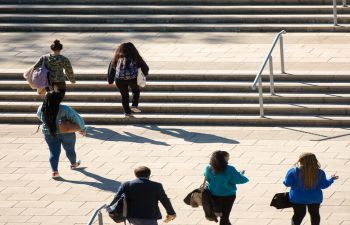 Students and staff walking through campus