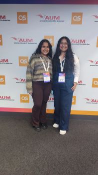 Two female students standing smiling