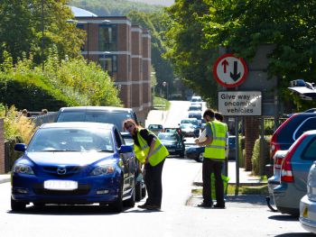 Parking ambassadors assisting drivers park on campus