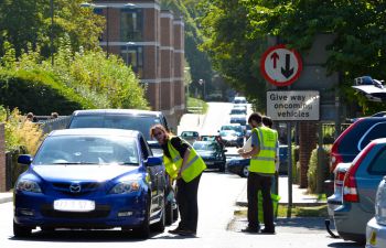 Parking ambassadors assisting drivers park on campus