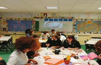 Young students seated at desks in a classroom