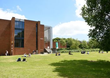 A view of Fulton on a sunny day, with people relaxing on the grass