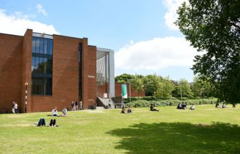 A view of Fulton on a sunny day, with people relaxing on the grass