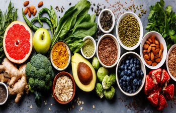 An array of healthy food items including fruit and vegetables