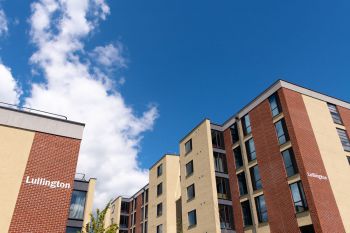 Student accommodation buildings against a blue sky