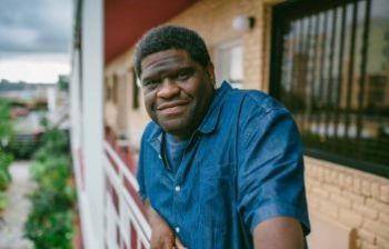 Gary Younge on a balcony