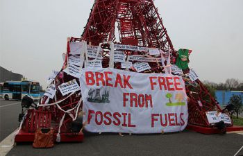 Protest barrier that says 'Break Free from Fossil Fuels'