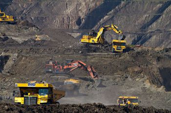 An image depicting diggers at an open pit coal mine