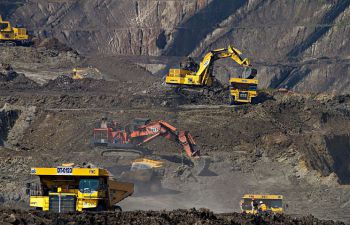 An image depicting diggers at an open pit coal mine