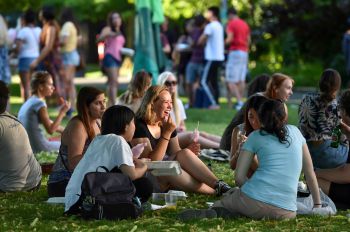 A group of students sitting outdoors