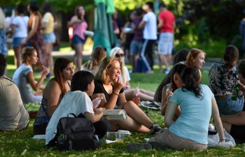 A group of students sitting outdoors