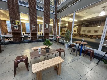 The Library cafe, with new wooden and mismatched furniture in situ