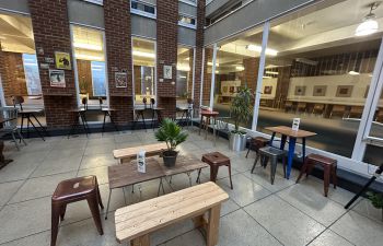 The Library cafe, with new wooden and mismatched furniture in situ