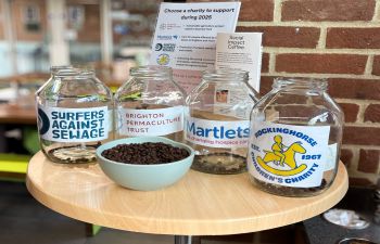 Participants voted by placing two coffee beans in the jars representing their favourite charities