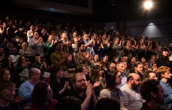 Crowd applauding in the Attenborough Centre at awards ceremony