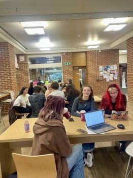 Students discussing catering during Foodie Forum