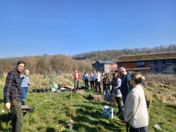 Students and staff prepare to plant a nuttery at the Sussex Forest Food Garden