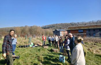 Students and staff prepare to plant a nuttery at the Sussex Forest Food Garden