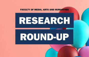 Text overlay: Research Round-up - over pink background a bunch of balloons