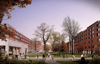 Digital image showing a building labelled as supermarket on the left side and red cladded building to the right with trees and grass in the middle.