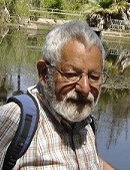 A photo of Professor Peter Senkar from SPRU outside by some water