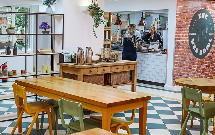 A woman being served inside the Veg Bowl cafe