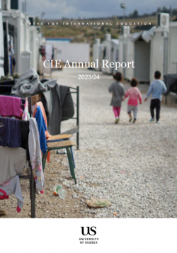 image of CIE's annual report front cover - features a woman teaching a toddler how to write 