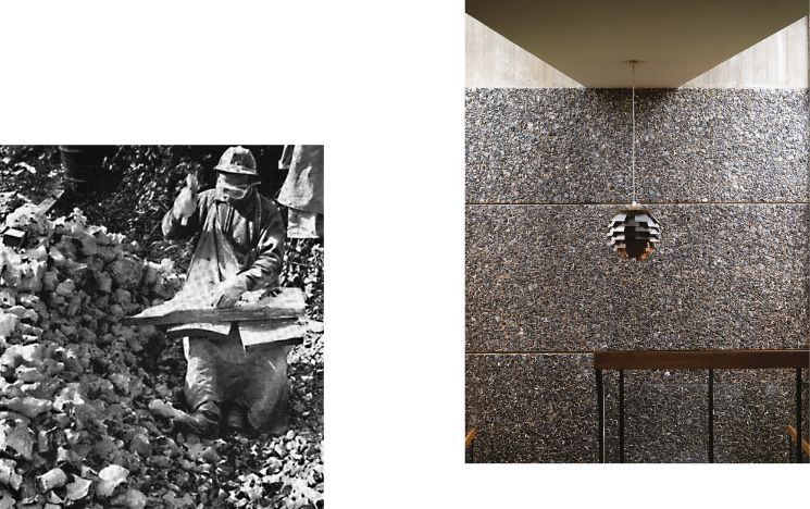 archive black and white photo of Polish flint knapper alongside the interior flint wall with hanging light, of Falmer House