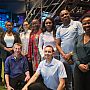 A large group of alumni reunite at a bar in Nairobi