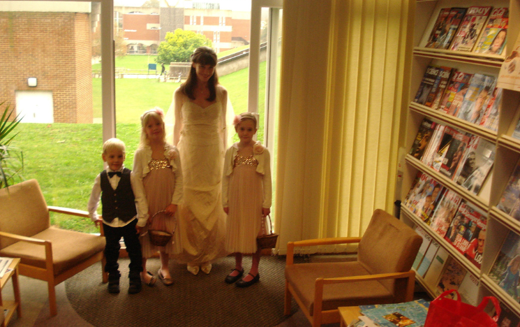 Alexandra stood with her children and her Maid of Honour's children in the Language Centre in Arts A, where she got dressed for her wedding.