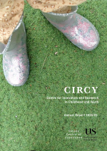 CIRCY Annual Report 24-25 Cover Image - shows a child's feet, wearing little velcro shoes, stood on some bright green astroturf.