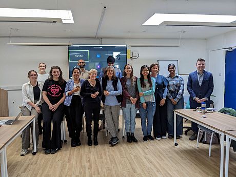 Group photo of the attendees at the Research in Progress Forum