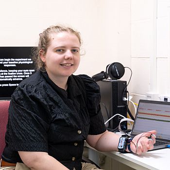 Dr Louisa Rinaldi wearing a tracking device on their wrist and fingers.