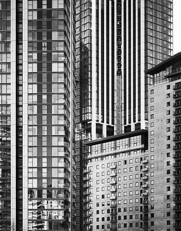 A modern high-rise in London photographed in black and white.