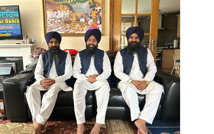 Hazuri Ragi Shri Darbar Sahib Amritsar Bhai Bhupinder Singh (on right) with his jatha in a British Asian home