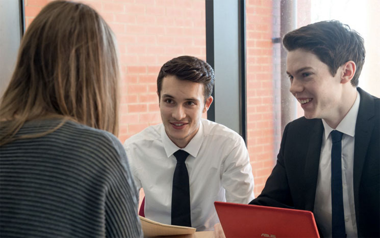 Two students take part in a mock interview session at the University of Sussex