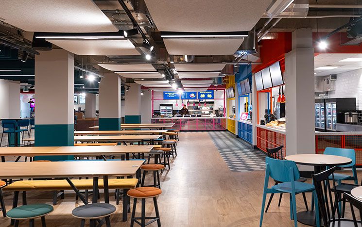 The seating area of Eat Central with chairs and tables