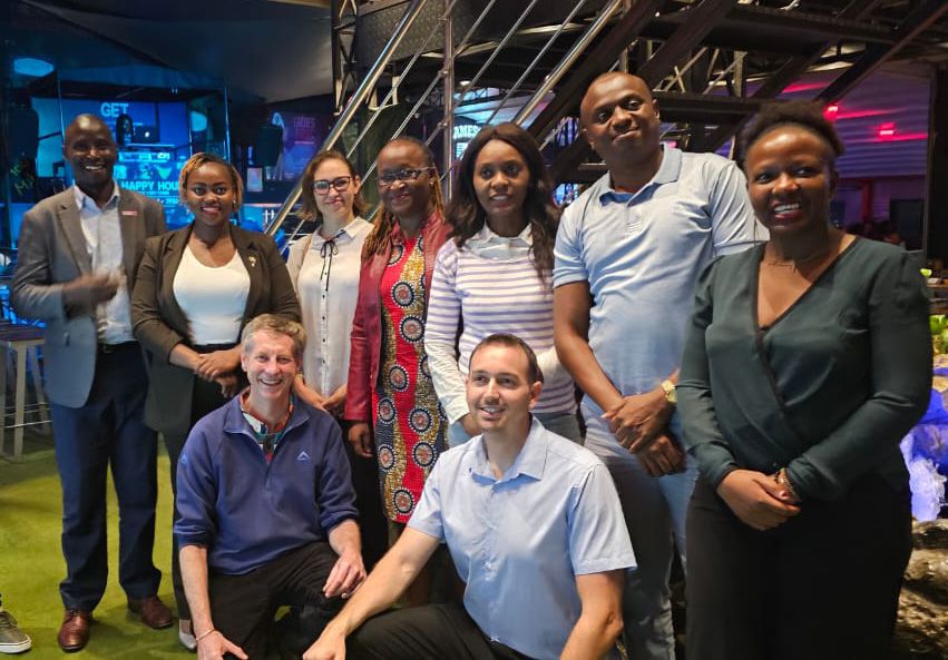 A large group of alumni reunite at a bar in Nairobi