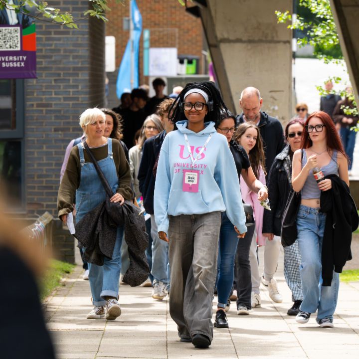 A Student Ambassador guides Open Day attendees through the campus A Student Ambassador guides Open Day attendees through the Sussex campus